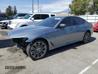 2020 BMW 5 Series 530e with VIN WBAJA9C06LCE66990, listed as a Copart auction lot 48823925 with 57,673 mi miles and Salvage Title. Bid and sale history available at carsss.com. Image 1.