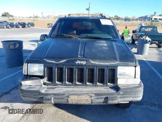 1998 Jeep Grand Cherokee Limited with VIN 1J4GX78Y8WC110325, listed as a IAAI auction lot 41357373 with 165,106 mi miles. Bid and sale history available at carsss.com. Image 12.