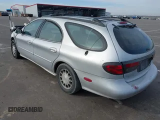 1999 Ford Taurus SE z VIN 1FAFP58S4XA299009, wystawiony jako IAAI lot #41775412 z przebiegiem 80 634 mil mil oraz . Historia ofert i sprzedaży dostępna na DreamBid. Obrazek 3.