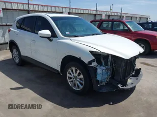 2014 Mazda CX-5 Touring with VIN JM3KE2CY2E0426164, listed as a IAAI auction lot 41812932 with 186,015 mi miles. Bid and sale history available at carsss.com. Image 1.