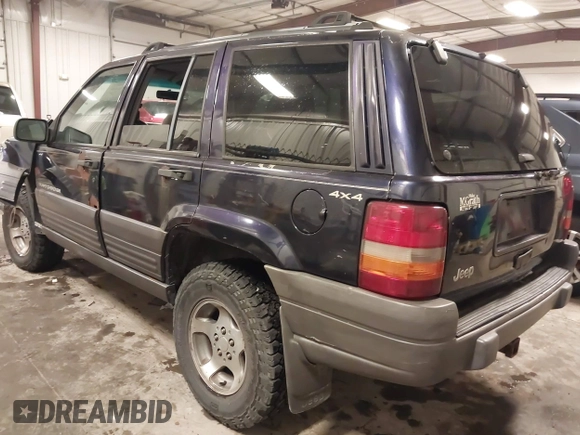 1997 Jeep Grand Cherokee Laredo with VIN 1J4GZ58S8VC675487, listed as a IAAI auction lot 41034046 with 243,284 mi miles. Bid and sale history available at carsss.com. Image 3.