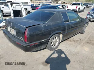 2001 Cadillac Eldorado Touring ETC z VIN 1G6ET12911B103774, wystawiony jako IAAI lot #41998828 z przebiegiem 128 724 mil mil oraz . Historia ofert i sprzedaży dostępna na DreamBid. Obrazek 4.
