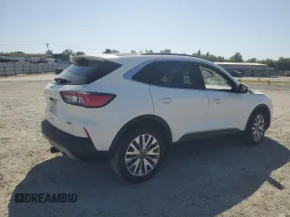 2020 Ford Escape Titanium Hybrid z VIN 1FMCU9DZ6LUC47658, wystawiony jako Copart lot #59599995 z przebiegiem 63 004 mil mil oraz Szkoda całkowita • Salvage title. Historia ofert i sprzedaży dostępna na DreamBid. Obrazek 3.