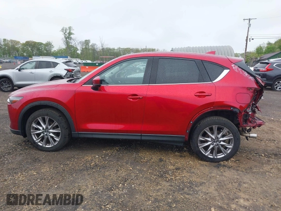 2020 Mazda CX-5 Grand Touring with VIN JM3KFBDM7L1731837, listed as a IAAI auction lot 42160795 with 63,826 mi miles and . Bid and sale history available at DreamBid. Image 15.