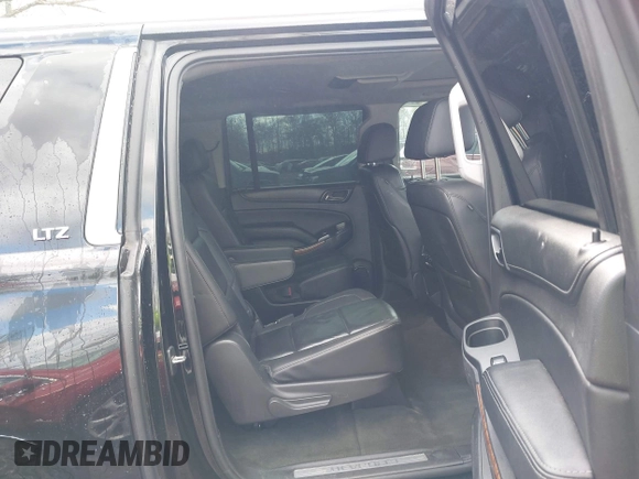 2015 Chevrolet Suburban LTZ with VIN 1GNSKKKC5FR255373, listed as a IAAI auction lot 42012528 with 219,030 mi miles and . Bid and sale history available at DreamBid. Image 8.