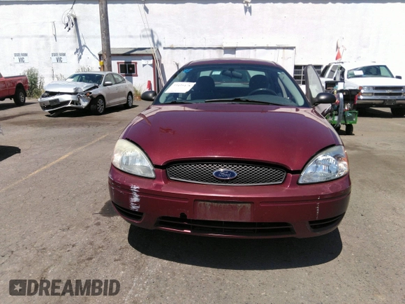 2005 Ford Taurus SE with VIN 1FAFP53U85A129306, listed as a IAAI auction lot 40585457 with 329,569 mi miles. Bid and sale history available at carsss.com. Image 6.
