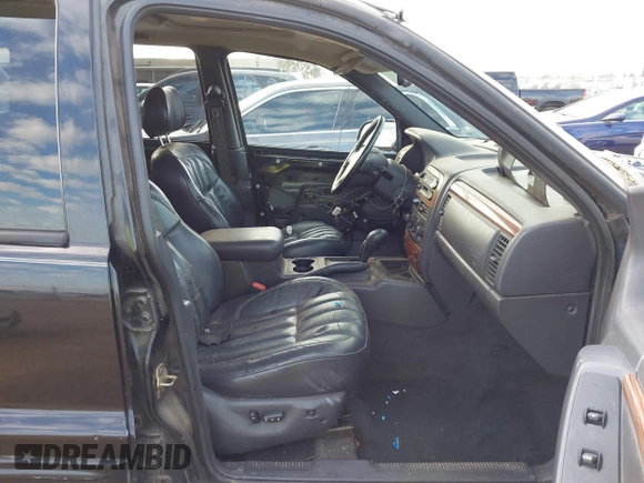 1999 Jeep Grand Cherokee Limited with VIN 1J4GW68NXXC637464, listed as a IAAI auction lot 41561690 with 235,728 mi miles. Bid and sale history available at carsss.com. Image 5.