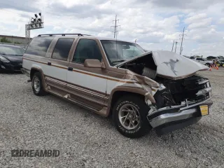 1999 Chevrolet Suburban with VIN 3GNEC16R9XG143471, listed as a Copart auction lot 53856565 with 208,621 mi miles and Salvage title. Bid and sale history available at DreamBid. Image 4.
