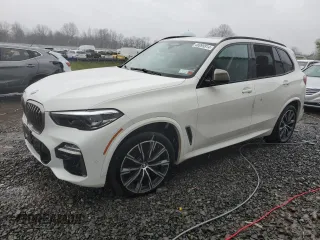 2020 BMW X5 M50i with VIN 5UXJU4C08L9C39129, listed as a Copart auction lot 48999914 with 32,851 mi miles and Salvage Title. Bid and sale history available at carsss.com. Image 1.