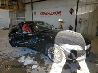 2015 BMW Z4 sDrive35i with VIN WBALM7C52FJ799104, listed as a Copart auction lot 88354535 with 56,560 mi miles and Salvage Title. Bid and sale history available at carsss.com. Image 4.
