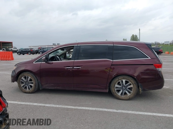 2014 Honda Odyssey Touring with VIN 5FNRL5H94EB127695, listed as a IAAI auction lot 41936109 with 221,786 mi miles and . Bid and sale history available at DreamBid. Image 14.