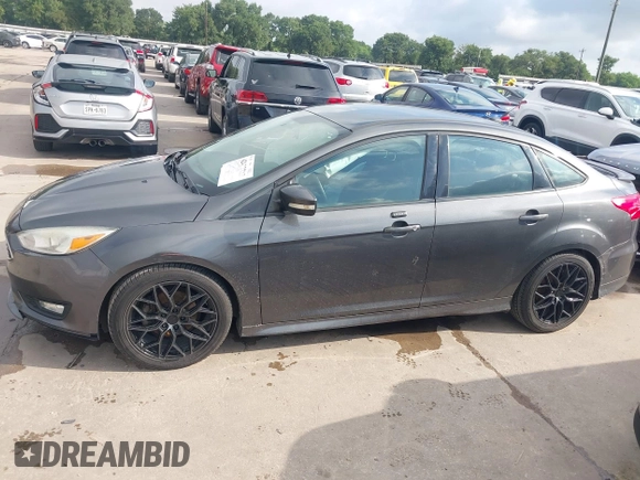 2016 Ford Focus SE z VIN 1FADP3F28GL360512, wystawiony jako IAAI lot #42427723 z przebiegiem 217 172 mil mil oraz . Historia ofert i sprzedaży dostępna na DreamBid. Obrazek 14.