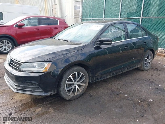 2018 Volkswagen Jetta 1.4T SE with VIN 3VWDB7AJ8JM240887, listed as a IAAI auction lot 40657661 with 76,568 mi miles. Bid and sale history available at carsss.com. Image 2.
