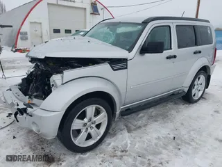 2011 Dodge Nitro Heat with VIN 1D4PU4GX1BW607458, listed as a IAAI auction lot 41279270 with 90,969 mi miles. Bid and sale history available at carsss.com. Image 18.