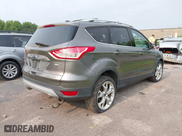2013 Ford Escape Titanium with VIN 1FMCU9J96DUD74870, listed as a IAAI auction lot 42415332 with 178,651 mi miles and . Bid and sale history available at DreamBid. Image 4.