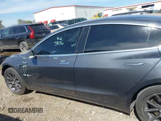 2019 Tesla Model 3 Mid Range with VIN 5YJ3E1EA5KF327679, listed as a IAAI auction lot 41804379 with 87,208 mi miles and . Bid and sale history available at DreamBid. Image 14.