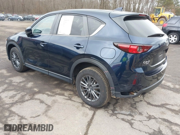 2021 Mazda CX-5 Touring with VIN JM3KFBCM7M1380396, listed as a IAAI auction lot 41707612 with 55,555 mi miles. Bid and sale history available at carsss.com. Image 3.