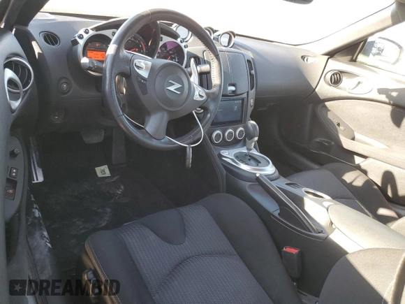 2014 Nissan 370Z Nismo with VIN JN1AZ4EH6EM633797, listed as a Copart auction lot 87879675 with 21,410 mi miles and Salvage Title. Bid and sale history available at DreamBid. Image 8.