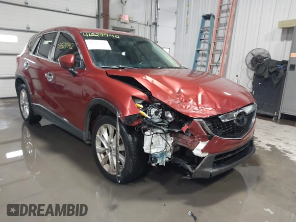 2013 Mazda CX-5 Grand Touring with VIN JM3KE2DE3D0120609, listed as a IAAI auction lot 41527942 with 215,176 mi miles. Bid and sale history available at carsss.com. Image 1.