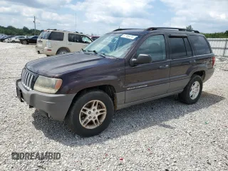 2004 Jeep Grand Cherokee Laredo with VIN 1J4GW48S64C121057, listed as a Copart auction lot 67765474 with 166,359 mi miles and Salvage title. Bid and sale history available at DreamBid. Image 1.