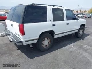 1997 Chevrolet Tahoe with VIN 1GNEK13R6VJ443195, listed as a IAAI auction lot 42000733 with 202,106 mi miles. Bid and sale history available at carsss.com. Image 4.