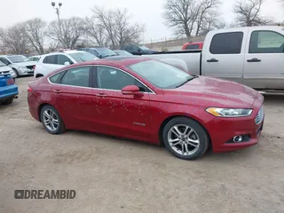 2016 Ford Fusion Titanium Hybrid with VIN 3FA6P0RU3GR355398, listed as a IAAI auction lot 41140669 with 125,959 mi miles. Bid and sale history available at carsss.com. Image 13.