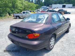 1999 Hyundai Elantra z VIN KMHJF25F1XU806648, wystawiony jako IAAI lot #42331073 z przebiegiem 196 577 mil mil oraz . Historia ofert i sprzedaży dostępna na DreamBid. Obrazek 4.