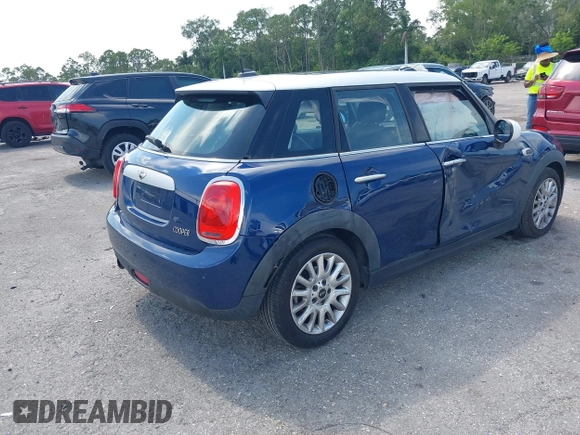 2015 MINI Hardtop 4 Door with VIN WMWXS5C51FT827510, listed as a IAAI auction lot 42365599 with 53,667 mi miles and . Bid and sale history available at DreamBid. Image 4.