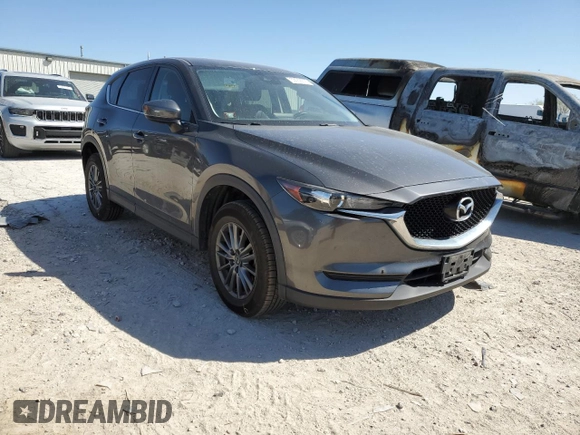 2017 Mazda CX-5 Touring with VIN JM3KFACL1H0100436, listed as a Copart auction lot 53058875 with 77,205 mi miles and Salvage Title. Bid and sale history available at DreamBid. Image 4.