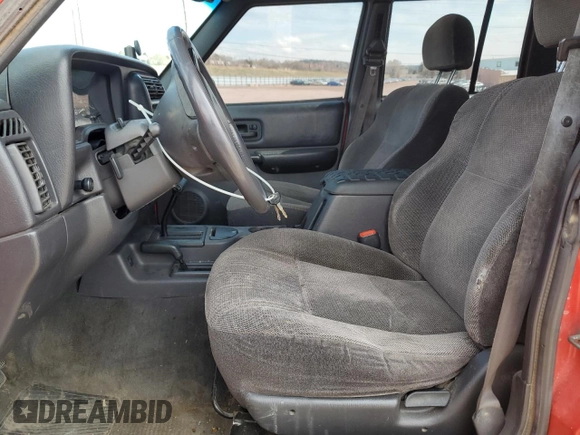 1999 Jeep Cherokee Sport with VIN 1J4FF68S6XL574980, listed as a Copart auction lot 51639635 with 257,854 mi miles and Salvage Title. Bid and sale history available at carsss.com. Image 7.