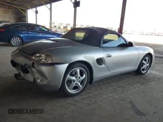 1997 Porsche Boxster с VIN WP0CA2984VS621039, выставлен на аукционе Copart как лот 60274455 с пробегом 59 619 миль миль и Списание • Salvage title. История ставок и продаж доступна на DreamBid. Изображение 3.