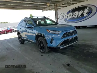 2022 Toyota RAV4 Hybrid SE with VIN 4T3T6RFV7NU103423, listed as a Copart auction lot 59709215 with 27,595 mi miles and Salvage title. Bid and sale history available at DreamBid. Image 14.