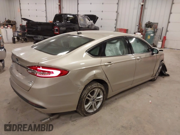 2018 Ford Fusion SE z VIN 3FA6P0HD2JR201693, wystawiony jako IAAI lot #42012709 z przebiegiem 110 857 mil mil oraz . Historia ofert i sprzedaży dostępna na DreamBid. Obrazek 4.