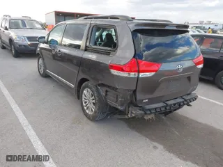 2013 Toyota Sienna XLE AAS with VIN 5TDYK3DC1DS396526, listed as a IAAI auction lot 41734256 with 218,723 mi miles. Bid and sale history available at carsss.com. Image 3.