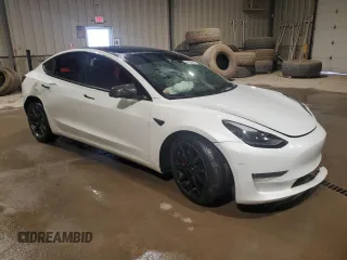 2021 Tesla Model 3 Standard Range Plus with VIN 5YJ3E1EA5MF987000, listed as a Copart auction lot 87638485 with Not Provided miles and Salvage Title. Bid and sale history available at DreamBid. Image 4.