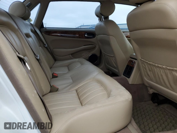 1999 Jaguar XJ with VIN SAJHX1040XC864208, listed as a Copart auction lot 59748585 with 130,577 mi miles and Clean title. Bid and sale history available at DreamBid. Image 10.