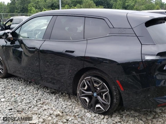 2024 BMW iX xDrive50 with VIN WB523CF09RCP70617, listed as a Copart auction lot 58091014 with 2,539 mi miles and Salvage Title. Bid and sale history available at carsss.com. Image 2.