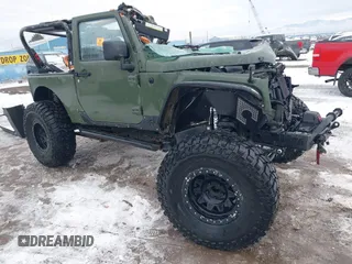 2015 Jeep Wrangler Rubicon Hard Rock z VIN 1C4BJWCG3FL586170, wystawiony jako IAAI lot #41218838 z przebiegiem Nie podano mil oraz . Historia ofert i sprzedaży dostępna na DreamBid. Obrazek 1.
