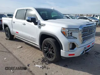 2021 GMC Sierra 1500 Denali z VIN 1GTU9FET3MZ308682, wystawiony jako IAAI lot #41093456 z przebiegiem 64 909 mil mil oraz . Historia ofert i sprzedaży dostępna na DreamBid. Obrazek 1.