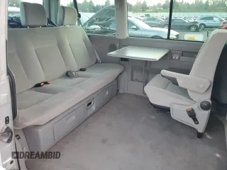 2003 Volkswagen EuroVan MV с VIN WV2MB47053H002505, выставлен на аукционе Copart как лот 83840884 с пробегом 250 786 миль миль и Чистый • Clean title. История ставок и продаж доступна на DreamBid. Изображение 11.