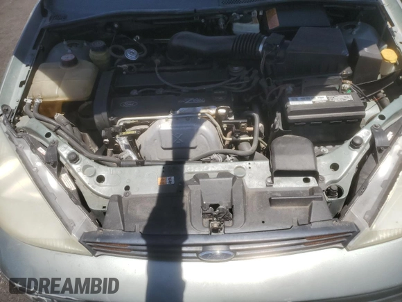 2004 Ford Focus SE with VIN 1FAFP36384W191801, listed as a Copart auction lot 63661465 with 144,226 mi miles and Salvage title. Bid and sale history available at DreamBid. Image 11.