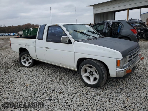 1990 Nissan Frontier with VIN 1N6SD16S9LC404281, listed as a Copart auction lot 84214904 with 279,270 mi miles and Salvage title. Bid and sale history available at DreamBid. Image 4.
