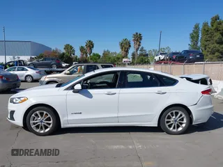2019 Ford Fusion Hybrid SE with VIN 3FA6P0LU9KR207824, listed as a IAAI auction lot 42153330 with 69,966 mi miles. Bid and sale history available at carsss.com. Image 14.