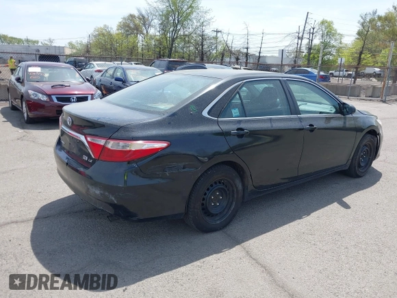 2015 Toyota Camry LE with VIN 4T1BD1FKXFU164963, listed as a IAAI auction lot 42132724 with 141,089 mi miles and . Bid and sale history available at DreamBid. Image 4.