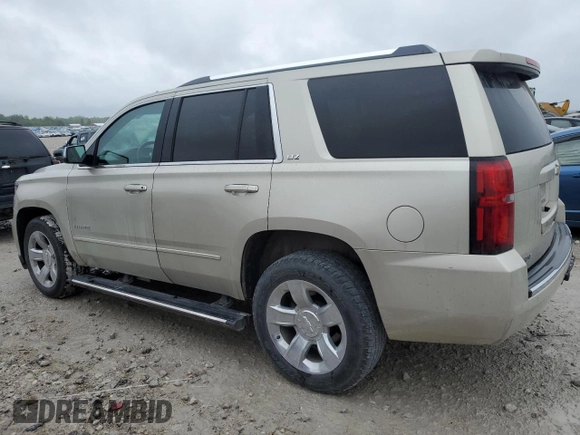 2015 Chevrolet Tahoe LTZ z VIN 1GNSKCKC5FR100084, wystawiony jako Copart lot #57677825 z przebiegiem 141 987 mil mil oraz Czysty tytuł • Clean title. Historia ofert i sprzedaży dostępna na DreamBid. Obrazek 2.