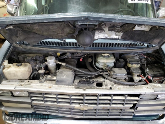 1995 Chevrolet Chevy Van z VIN 1GBEG25K2SF243949, wystawiony jako Copart lot #50422305 z przebiegiem 193 169 mil mil oraz Szkody całkowita. Historia ofert i sprzedaży dostępna na DreamBid. Obrazek 12.