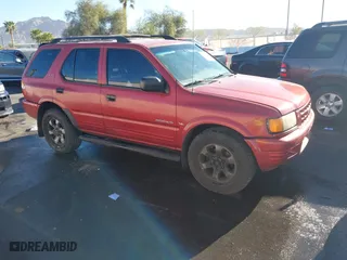 1999 Isuzu Rodeo S with VIN 4S2CK58W3X4307201, listed as a IAAI auction lot 41884901 with 236,970 mi miles. Bid and sale history available at carsss.com. Image 1.