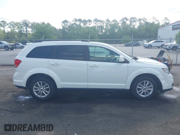 2015 Dodge Journey SXT with VIN 3C4PDCBG0FT653857, listed as a IAAI auction lot 42128410 with 182,960 mi miles and . Bid and sale history available at DreamBid. Image 13.