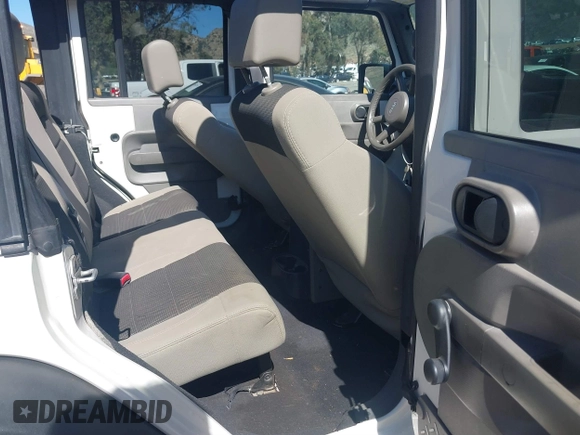 2007 Jeep Wrangler Unlimited X with VIN 1J4GB39147L133997, listed as a IAAI auction lot 41676009 with 110,849 mi miles and . Bid and sale history available at DreamBid. Image 8.