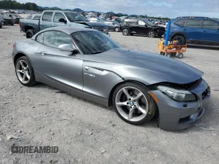 2011 BMW Z4 sDrive35is with VIN WBALM1C50BE633213, listed as a Copart auction lot 61220135 with 62,458 mi miles and Salvage title. Bid and sale history available at DreamBid. Image 4.